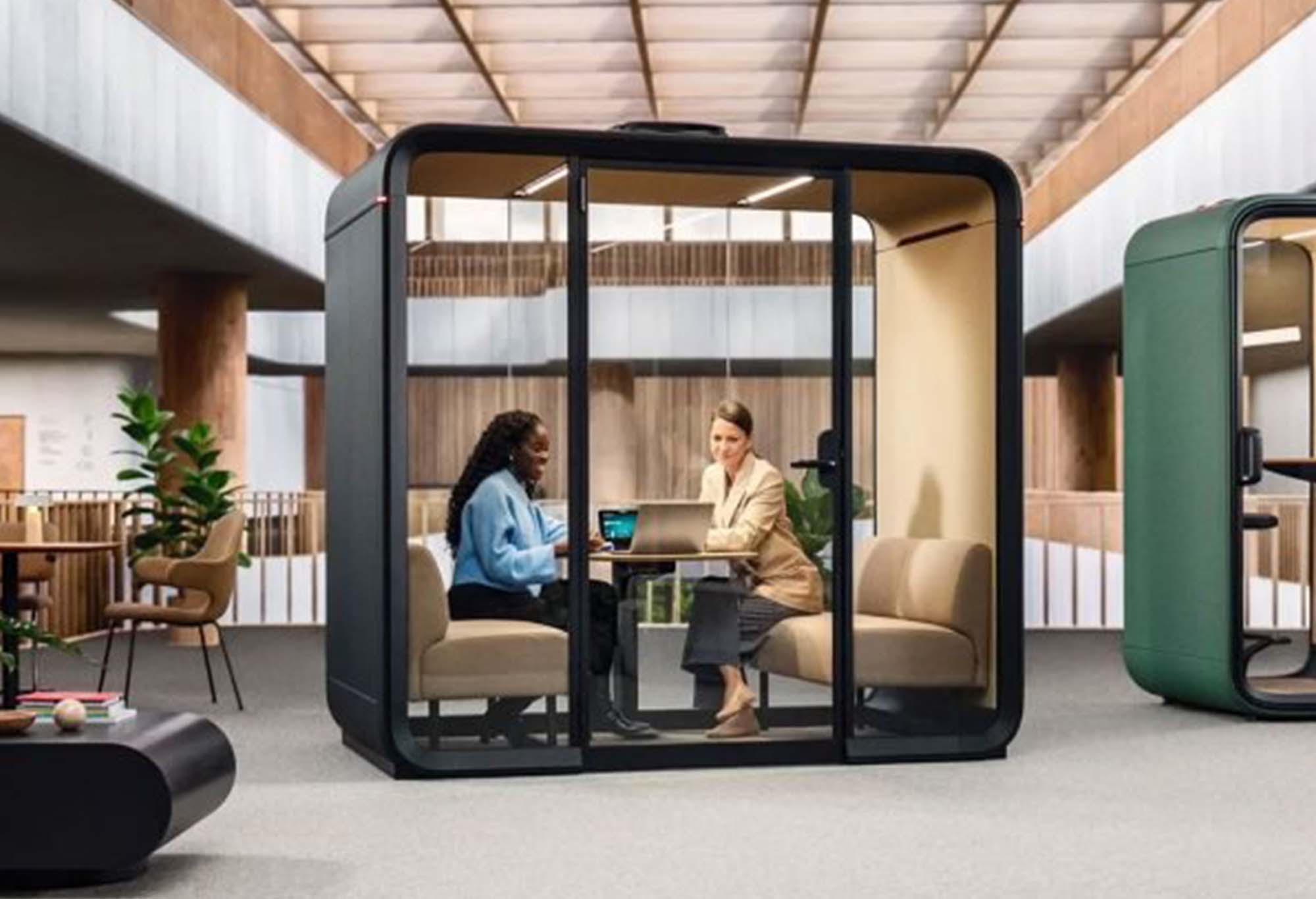 Two women meeting in a pod