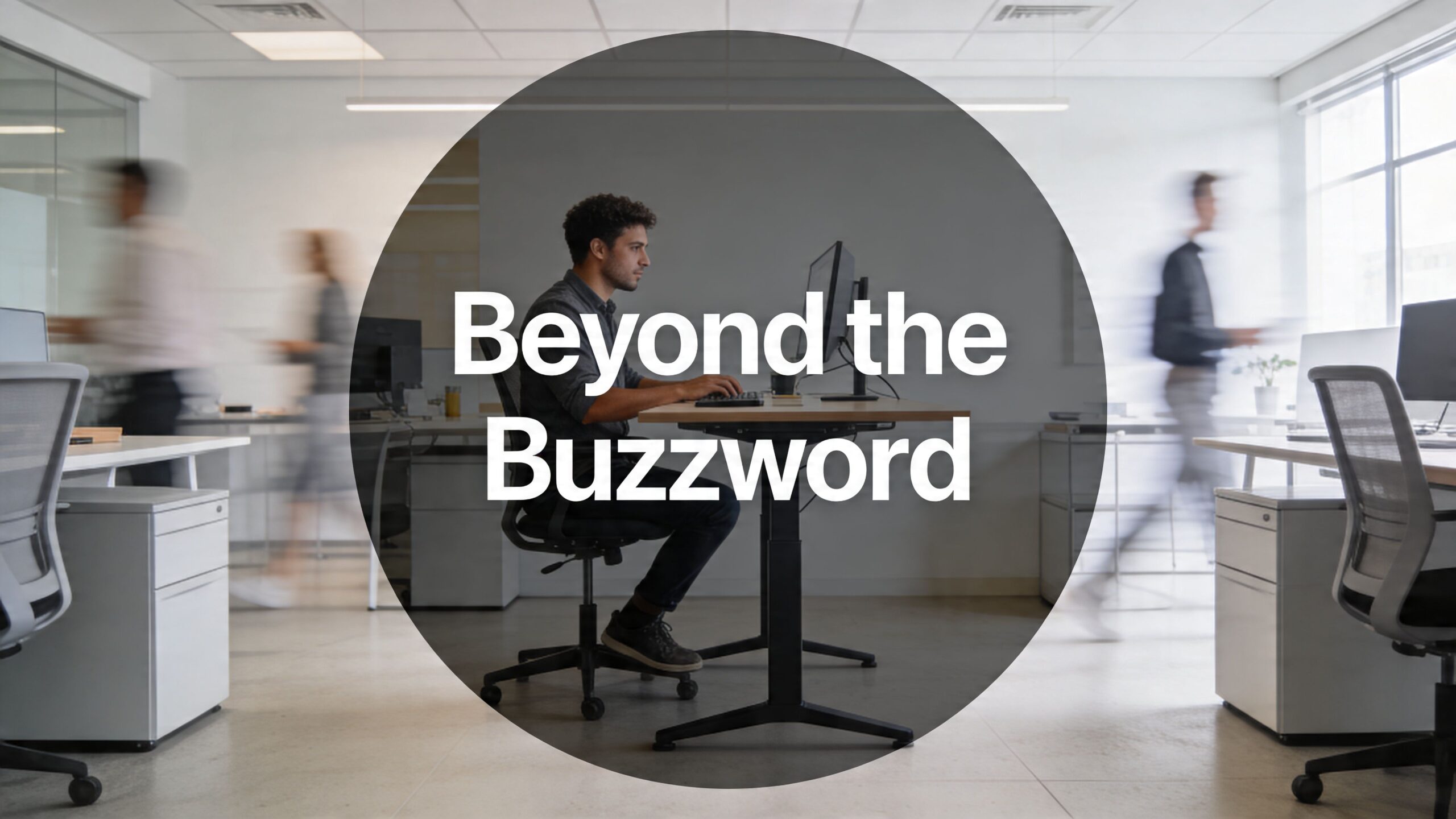man seated at desk with adjustable legs - caption beyond the buzzword